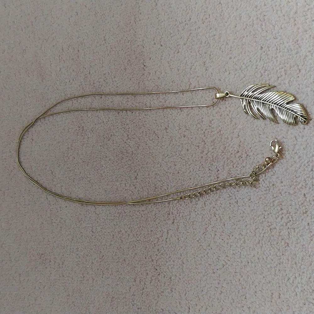 Gold feather statement necklace